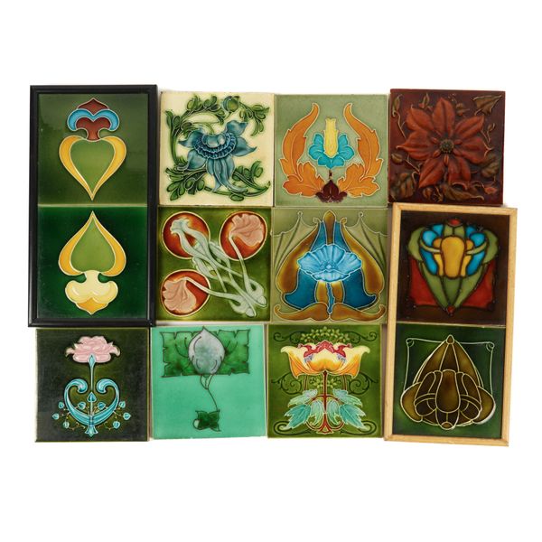 A GROUP OF ART NOUVEAU RELIEF PRESSED COLOUR GLAZED WALL TILES AND OTHERS (22)