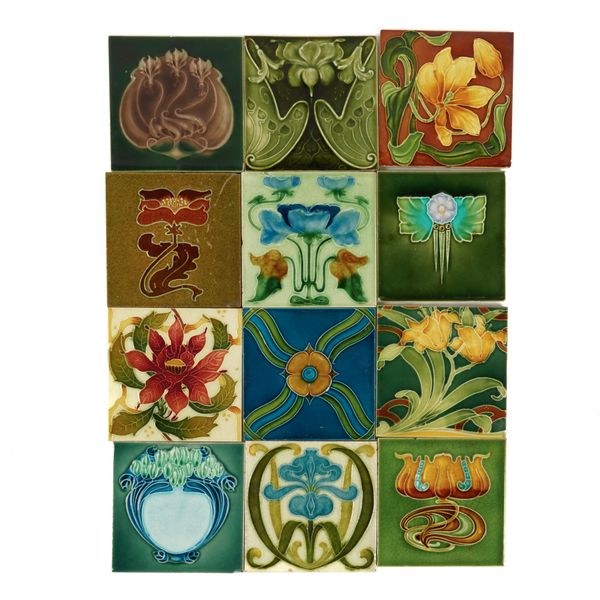 A GROUP OF TWENTY ART NOUVEAU PRESSED AND GLAZED TILES AND OTHERS (27)