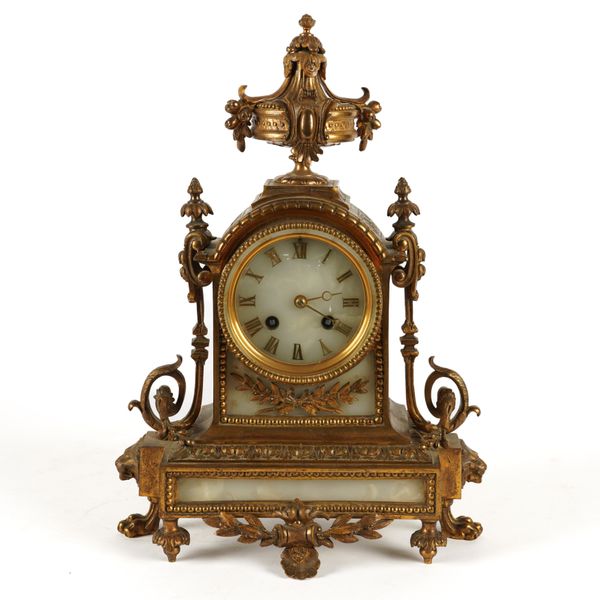 A FRENCH LOUIS XVI STYLE GILT-METAL AND WHITE ONYX MOUNTED MANTEL CLOCK