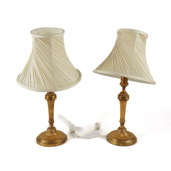 A PAIR OF LOUIS XVI STYLE GILT-METAL CANDLESTICK TABLE LAMPS (2)