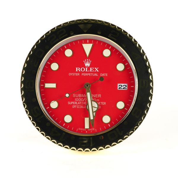 A METAL WALL CLOCK IN THE STYLE OF A ROLEX SUBMARINER