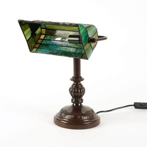 A TIFFANY STYLE GLASS MOUNTED METAL DESK LAMP