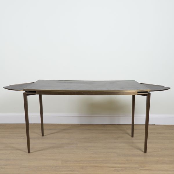 CARTIER;  A BRONZE LEATHER INSET CONCAVE WRITING DESK