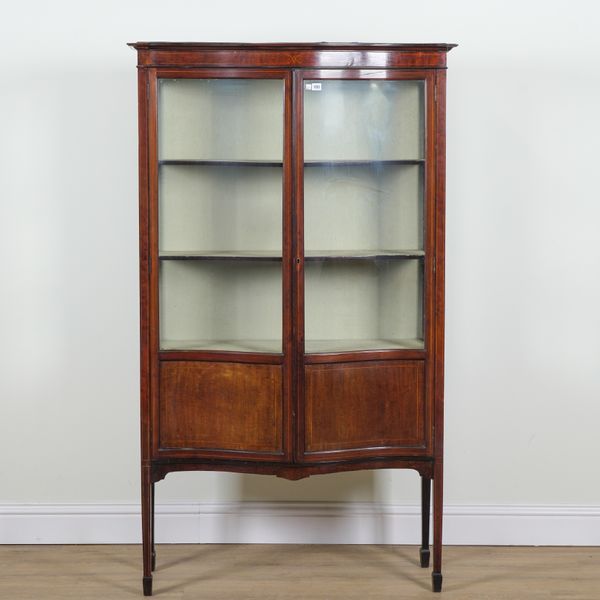 AN EDWARDIAN MAHOGANY SERPENTINE DISPLAY CABINET