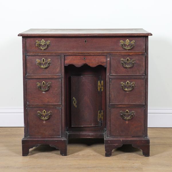 A GEORGE III MAHOGANY KNEEHOLE WRITING DESK