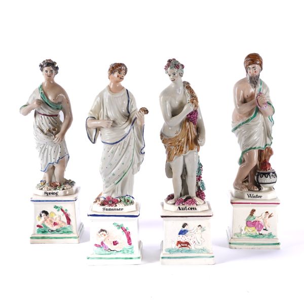 A SET OF FOUR STAFFORDSHIRE PEARLWARE FIGURES REPRESENTING THE SEASONS (4)