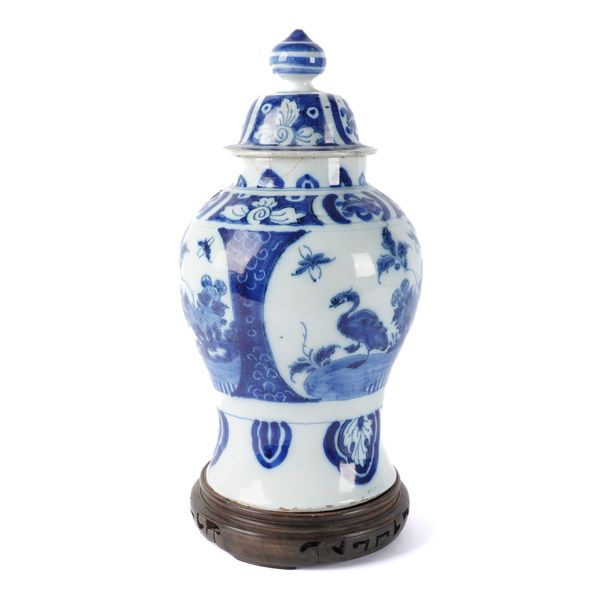 A DUTCH DELFT BLUE AND WHITE BALUSTER VASE AND COVER (3)