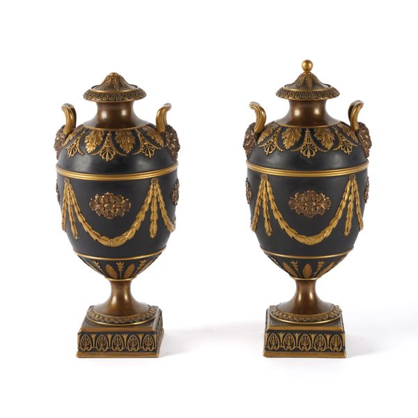 A PAIR OF WEDGWOOD BRONZE AND GILT BLACK BASALT URNS AND COVERS (4)