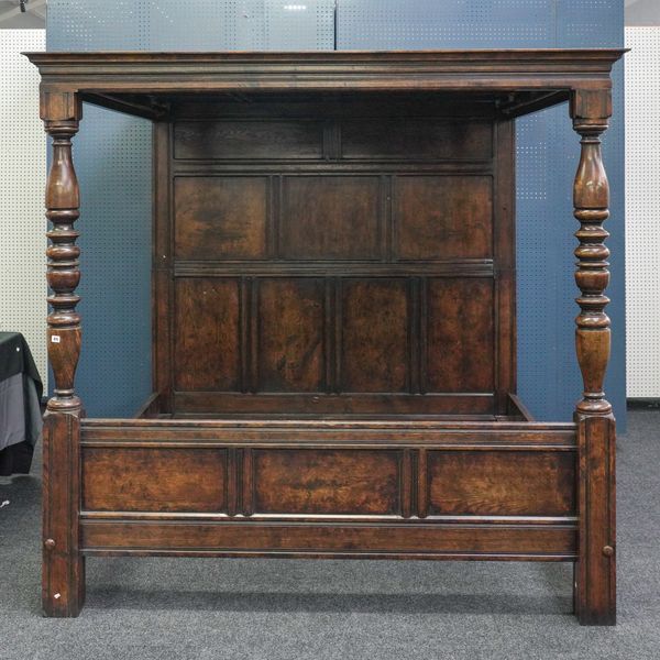 A 17TH CENTURY STYLE OAK FOUR POSTER BED