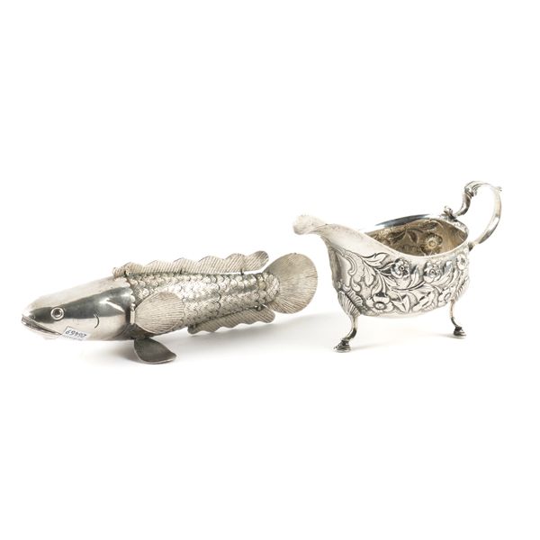 AN IRISH SILVER SAUCEBOAT AND A PLATED MODEL OF AN ARTICULATED FISH (2)