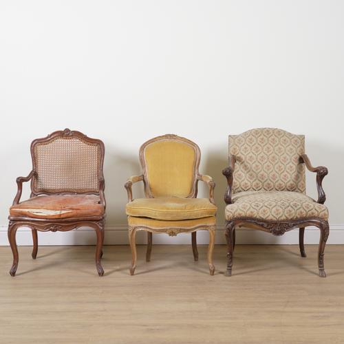 A LOUIS XV AND LATER CARVED STAINED BEECH FRAMED OPEN CANE ARMCHAIR (3)
