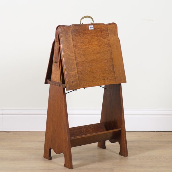 LIBERTY & CO; AN EARLY 20TH CENTURY OAK MAGAZINE RACK