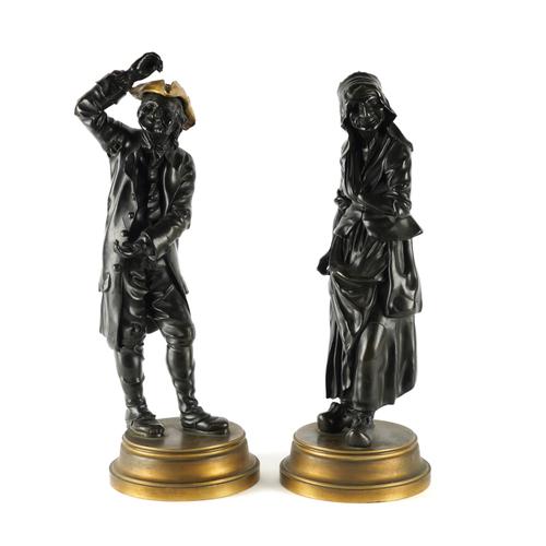 WITHDRAWN A PAIR OF PATINATED BRONZE AND GILT MOUNTED COMMEDIA DEL’ ARTE FIGURES, POSSIBLY PUNCHINELLO AND JOAN  (2)
