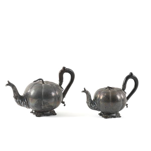 A PAIR OF GRADUATED TEAPOTS (2)