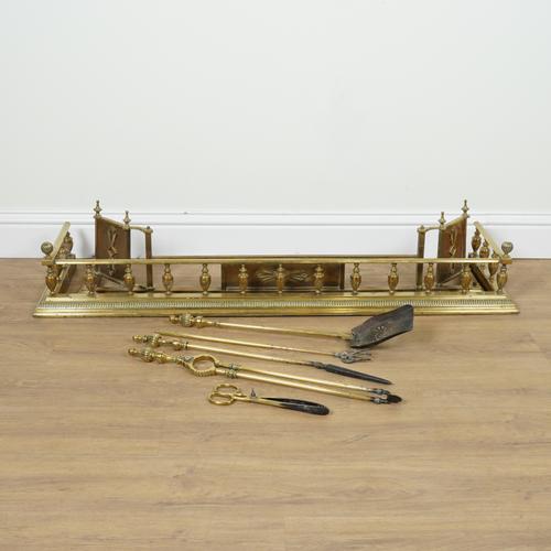 TWO EDWARDIAN BRASS HEARTH FENDERS AND BRASS FIRE TOOLS  (7)