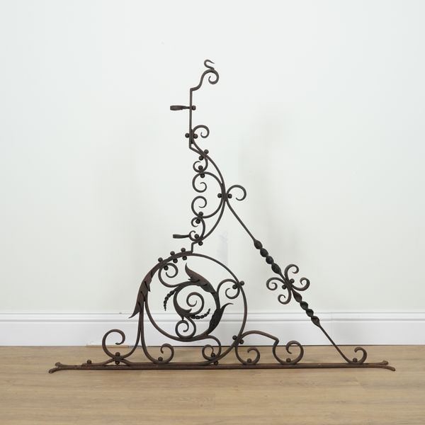 A WROUGHT AND CAST-IRON WALL MOUNTED BRACKET