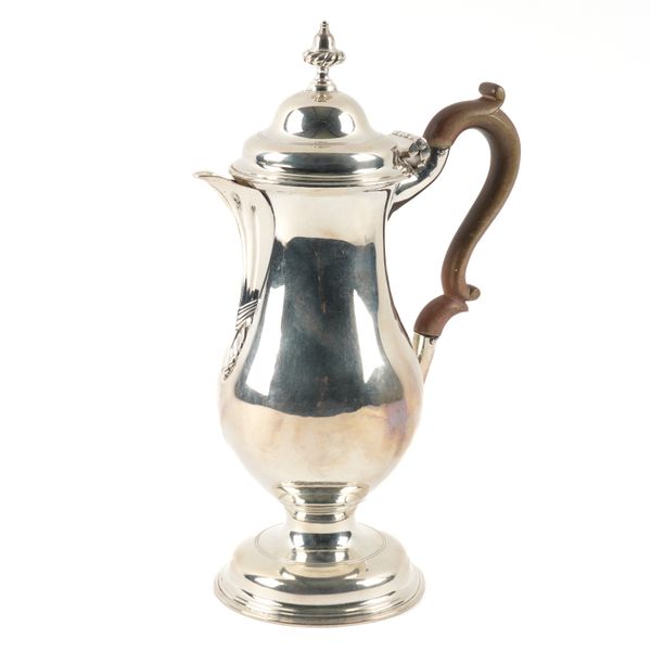 A GEORGE III SILVER HOT WATER JUG