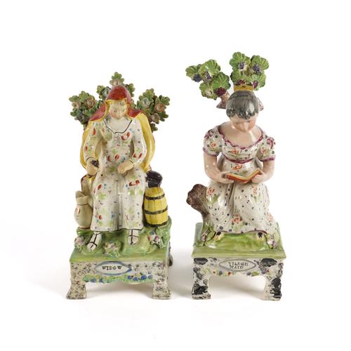 TWO OBADIAH SHERRATT TYPE PEARLWARE FIGURES OF `VILLAGE MAID' AND `WIDOW' (2)