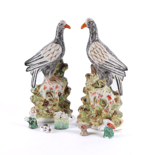 A PAIR OF STAFFORDSHIRE POTTERY FIGURES OF BIRDS (7)
