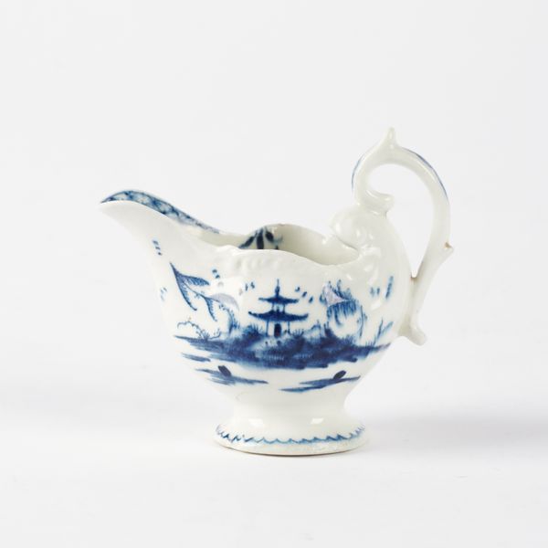 A DERBY DOLPHIN EWER BLUE AND WHITE CREAMBOAT