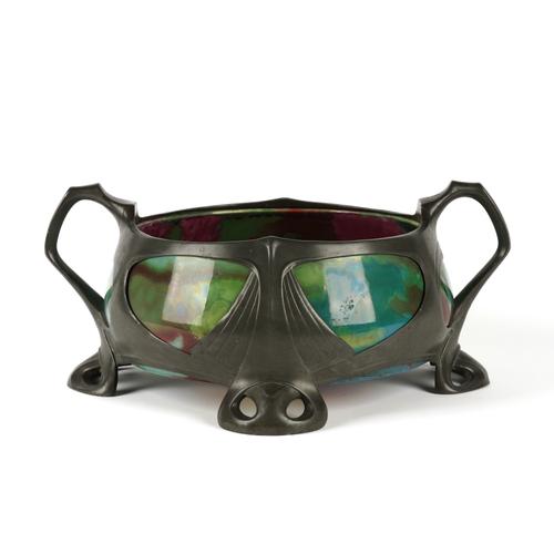 OSIRIS: A GERMAN ART NOUVEAU PEWTER AND CERAMIC MOUNTED TWIN-HANDLED JARDINIERE