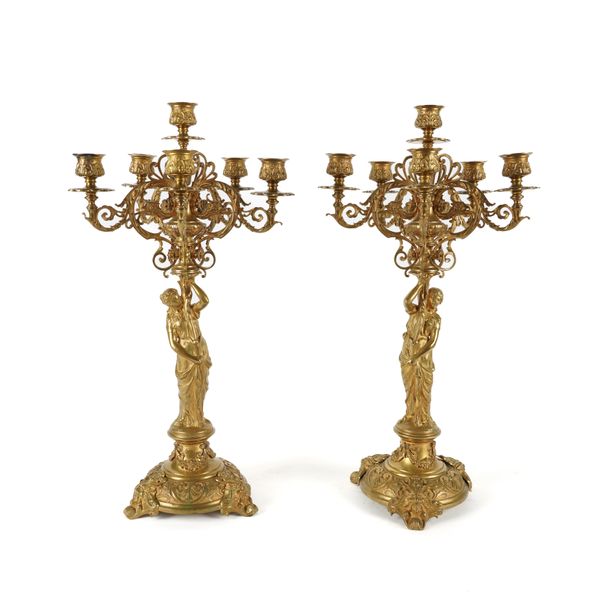 A PAIR OF FRENCH NEO-CLASSICAL STYLE GILT BRASS FIVE BRANCH FIGURAL CANDLEABRA (2)