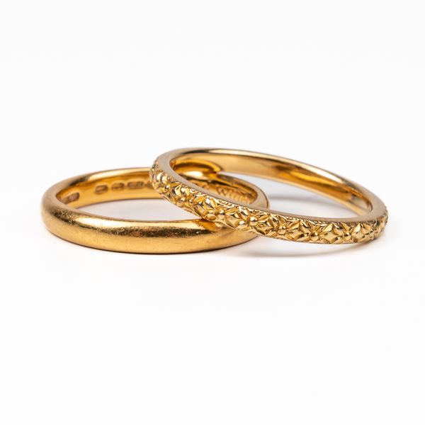 TWO GOLD WEDDING BAND RINGS (2)