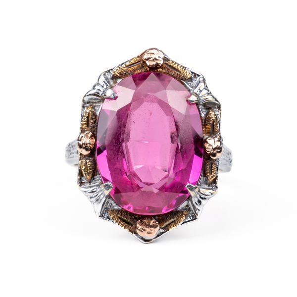 A WHITE GOLD AND SYNTHETIC PINK SAPPHIRE RING