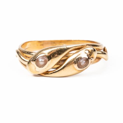 A GOLD AND HALF PEARL RING