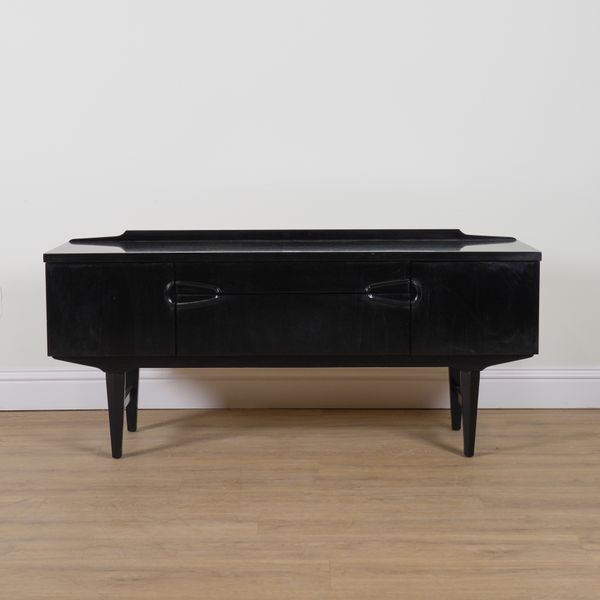 REMPLOY; A MID 20TH CENTURY EBONISED LOW SIDEBOARD