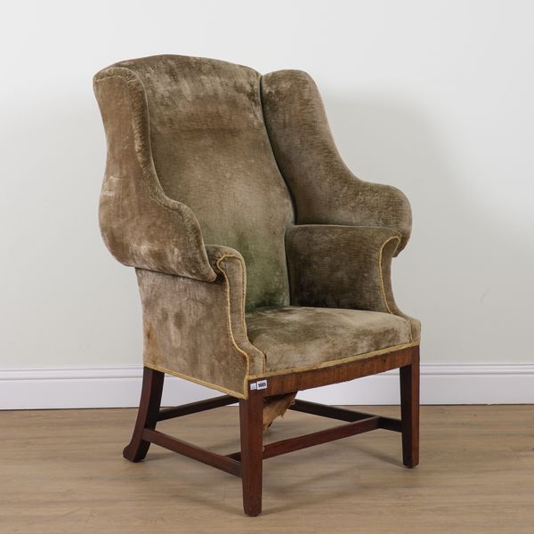 AN 18TH CENTURY STYLE SHAPED WINGBACK ARMCHAIR