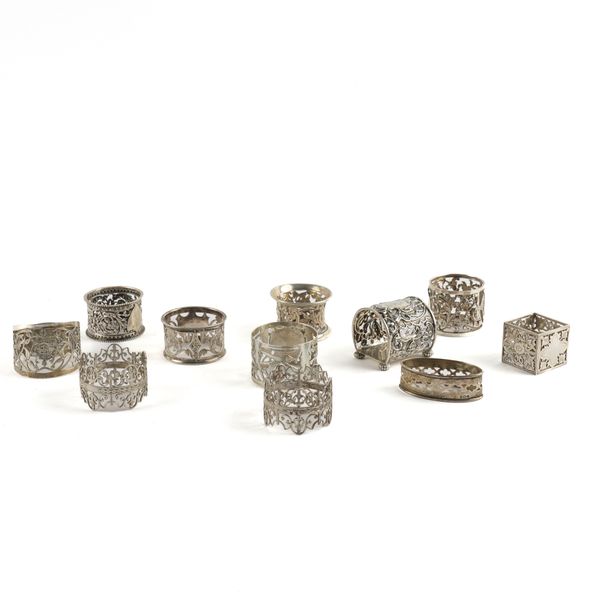 ELEVEN SILVER NAPKIN RINGS (11)