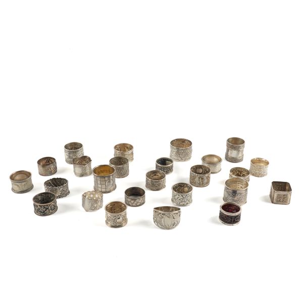 TWENTY-FIVE NAPKIN RINGS OF VARIOUS DESIGNS (25)