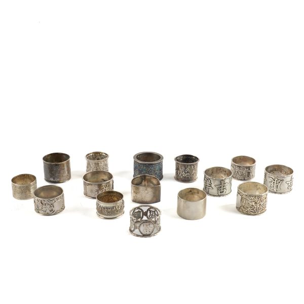 TWO SILVER NAPKIN RINGS AND THIRTEEN ASIAN NAPKIN RINGS INCLUDING CHINESE EXAMPLES (15)