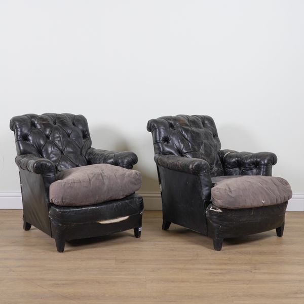 A PAIR OF EARLY 20TH CENTURY BLACK LEATHER BUTTON BACK UPHOLSTERED LOW ARMCHAIRS (2)