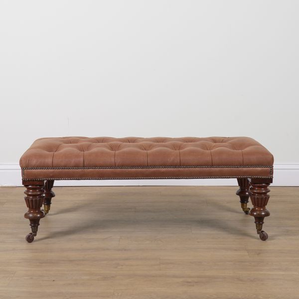 A LARGE RECTANGULAR STUDDED LEATHER UPHOLSTERED FOOTSTOOL