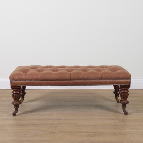 A LARGE RECTANGULAR STUDDED LEATHER UPHOLSTERED FOOTSTOOL