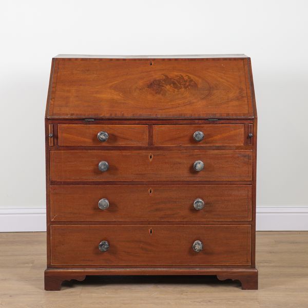 A LATE GEORGE III MAHOGANY BUREAU