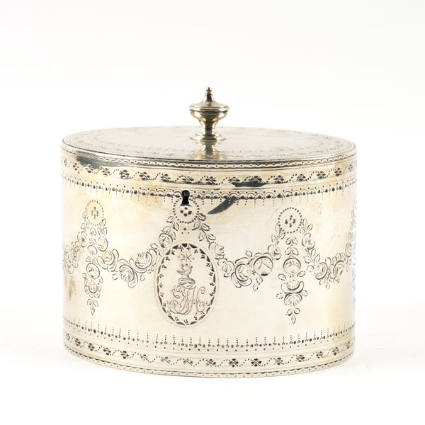 A GEORGE III SILVER OVAL HINGE LIDDED TEA CADDY