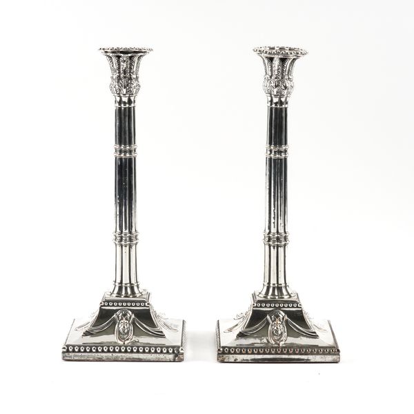 A PAIR OF SILVER PLATED ON COPPER TABLE CANDLESTICKS (2)