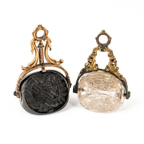 A ROCK CRYSTAL TRIPLE SIDED FOB SEAL AND AN AGATE TRIPLE SIDED FOB SEAL (2)