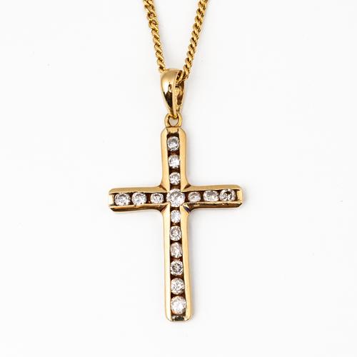 A 9CT GOLD AND DIAMOND PENDANT CROSS (2)