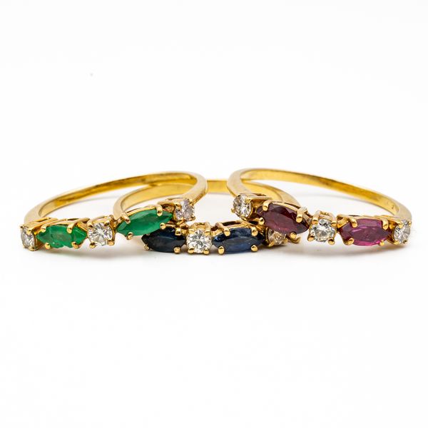 THREE GOLD, DIAMOND AND COLOURED GEMSTONE STACKING RINGS (3)