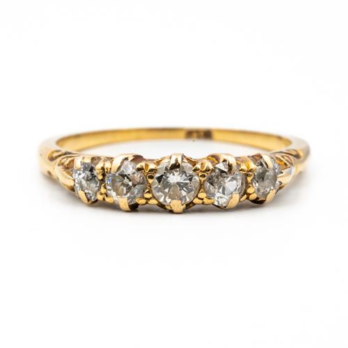 A GOLD AND DIAMOND FIVE STONE RING