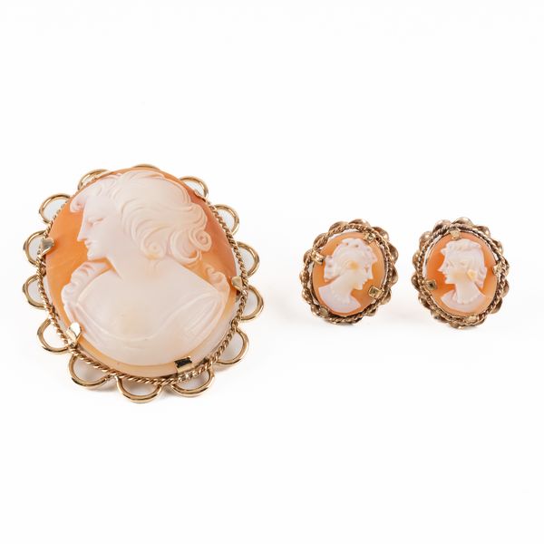 A 9CT GOLD MOUNTED OVAL SHELL CAMEO BROOCH AND A PAIR OF GILT METAL MOUNTED SHELL CAMEO EARSTUDS (3)