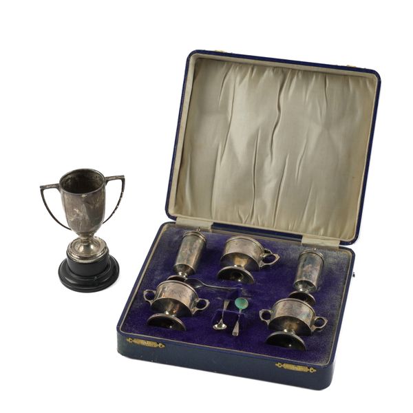 A SILVER FIVE PIECE CONDIMENT SET AND A SILVER TWIN HANDLED TROPHY CUP (3)