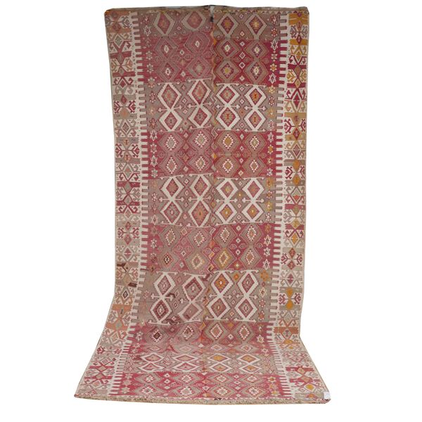 A TURKISH KILIM AND A HALF SECTION OF A TURKISH KILIM (2)