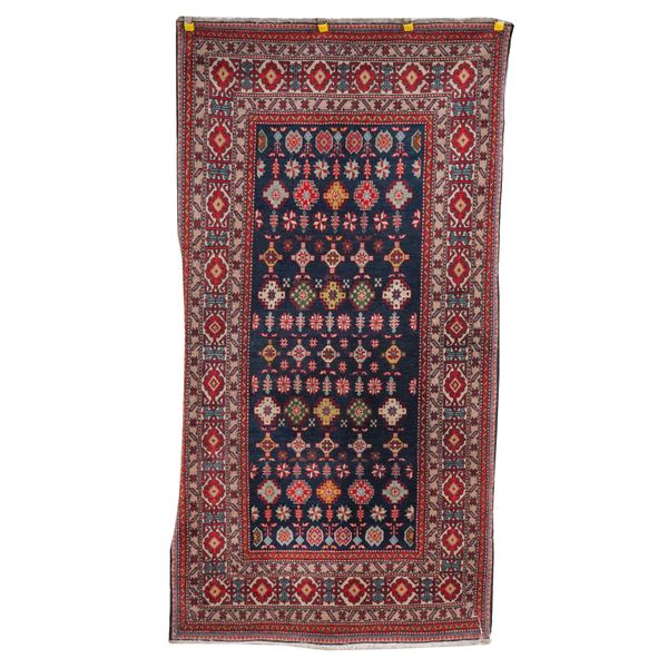 A TURKISH RUG OF CAUCASIAN DESIGN, A PERSIAN RUG, A PART SILK GHOM RUG (3)