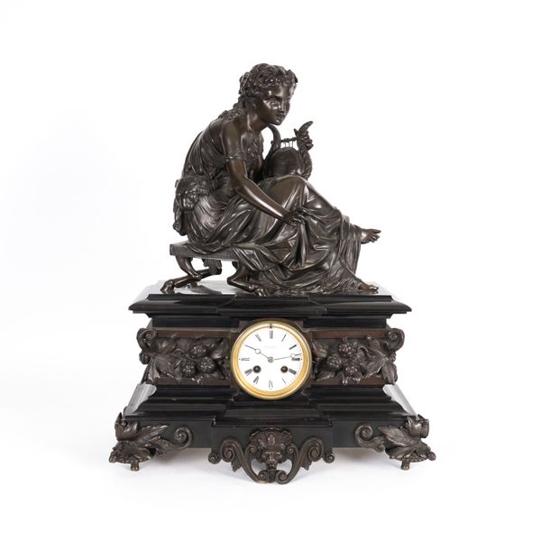 A FRENCH BRONZE AND MARBLE MANTEL CLOCK