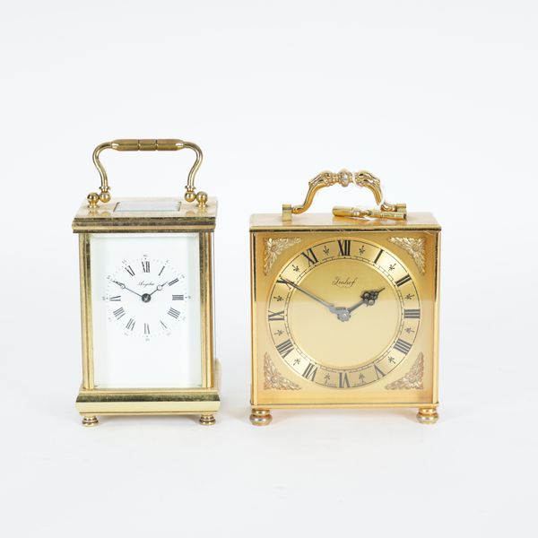 AN ENGLISH GILT LACQUERED BRASS CARRIAGE CLOCK (2)